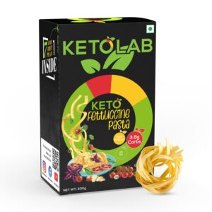 Box of Ketolab Fettuccine Pasta with a 7-day diet plan badge, highlighting 3.8g net carbs, 23% protein, and 2% fat. A coil of uncooked fettuccine is placed beside the box.