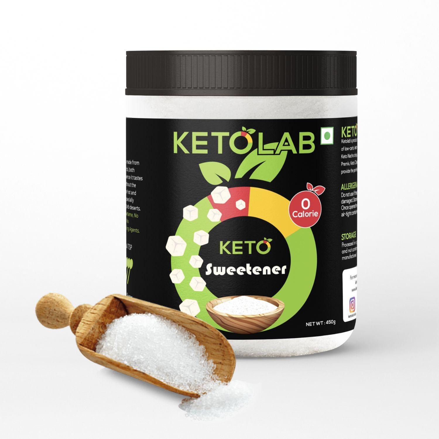 Ketolab Sweetener container with black lid and colorful label, featuring a wooden scoop spilling granulated sweetener in front, labeled 'KETO Sweetener' with '0 Calorie' badge, against a clean white background.